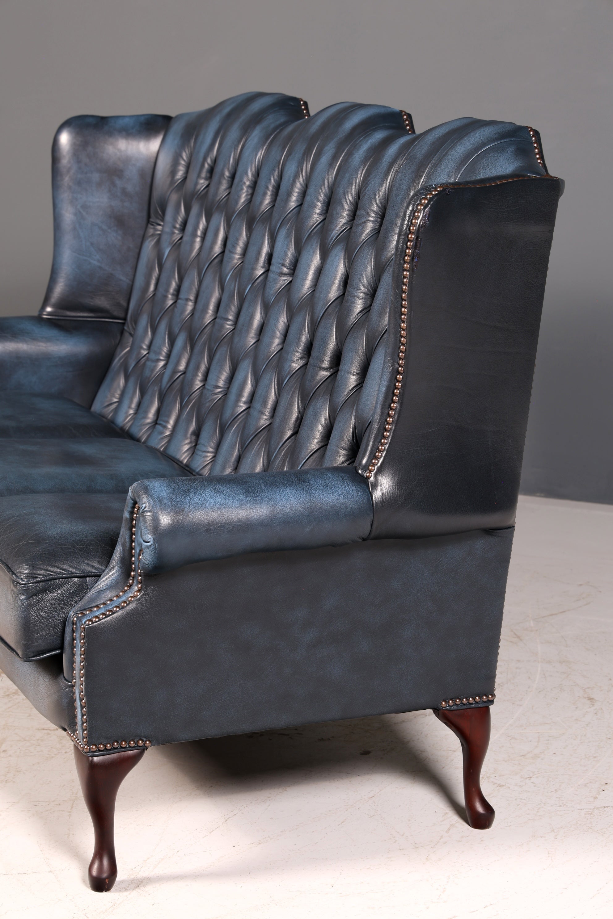Beautiful original Chesterfield three-seater sofa, Queen Anne, blue English leather couch, England upholstered sofa